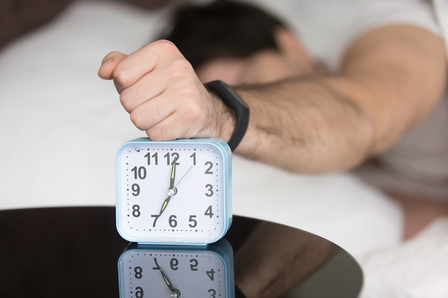 angry-sleepy-young-guy-turning-off-noisy-annoying-alarm-clock01
