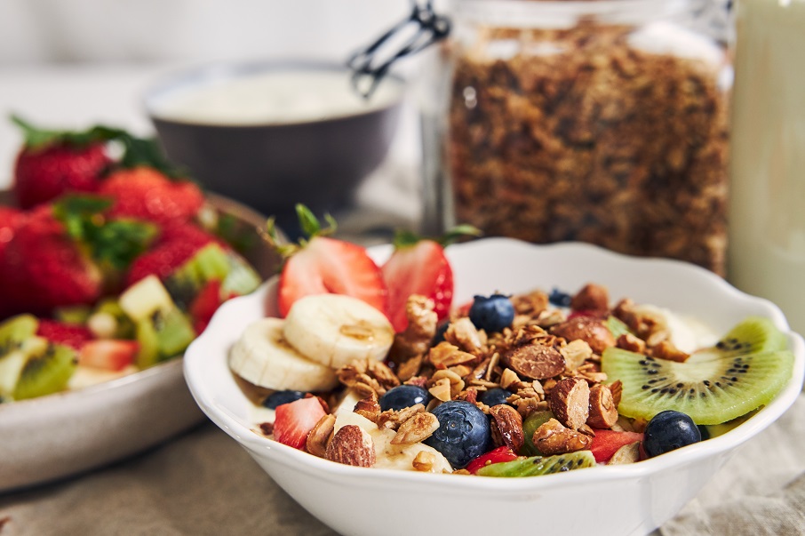 bowls-granola-with-yogurt-fruits-berries-white-surface