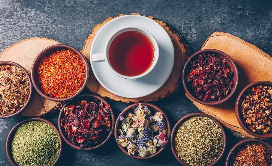 set-wood-stubs-cup-tea-tea-herbs-bowls-dark-textured-background-flat-lay