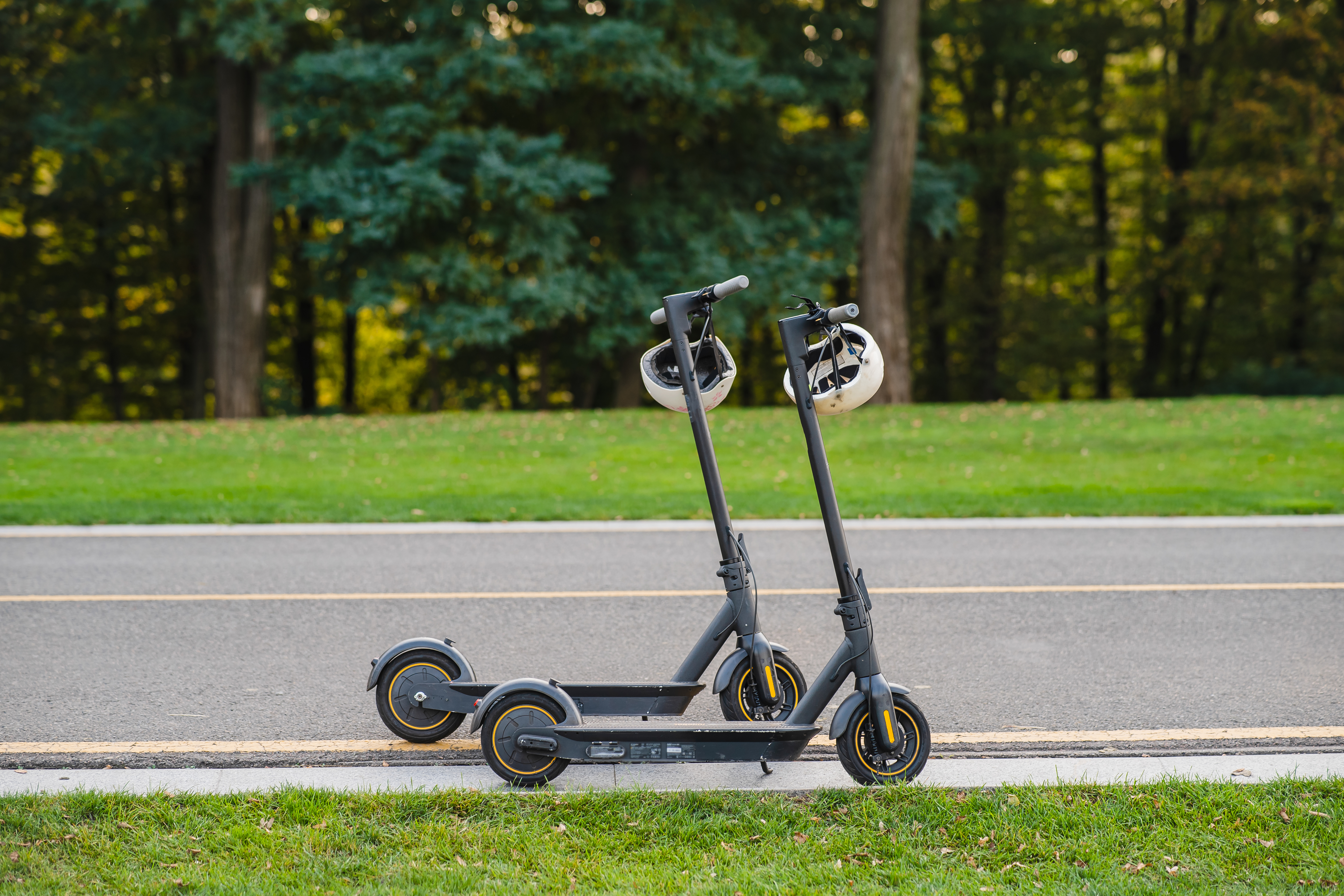 two-electric-kick-scooters-e-scooter-parked-sidelines-road